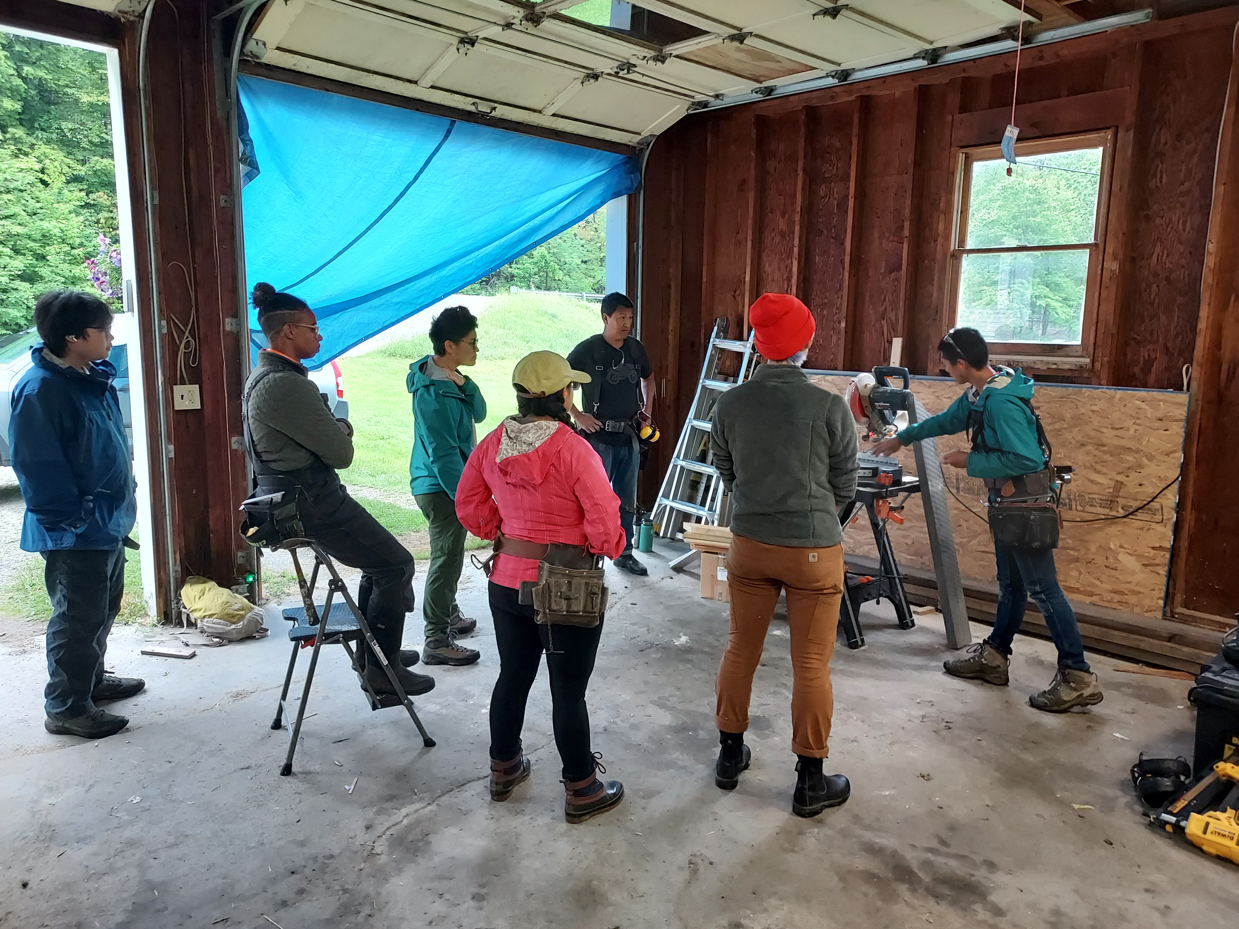 Members of Liberation Ecosystem, Inc. participating in a carpentry workshop