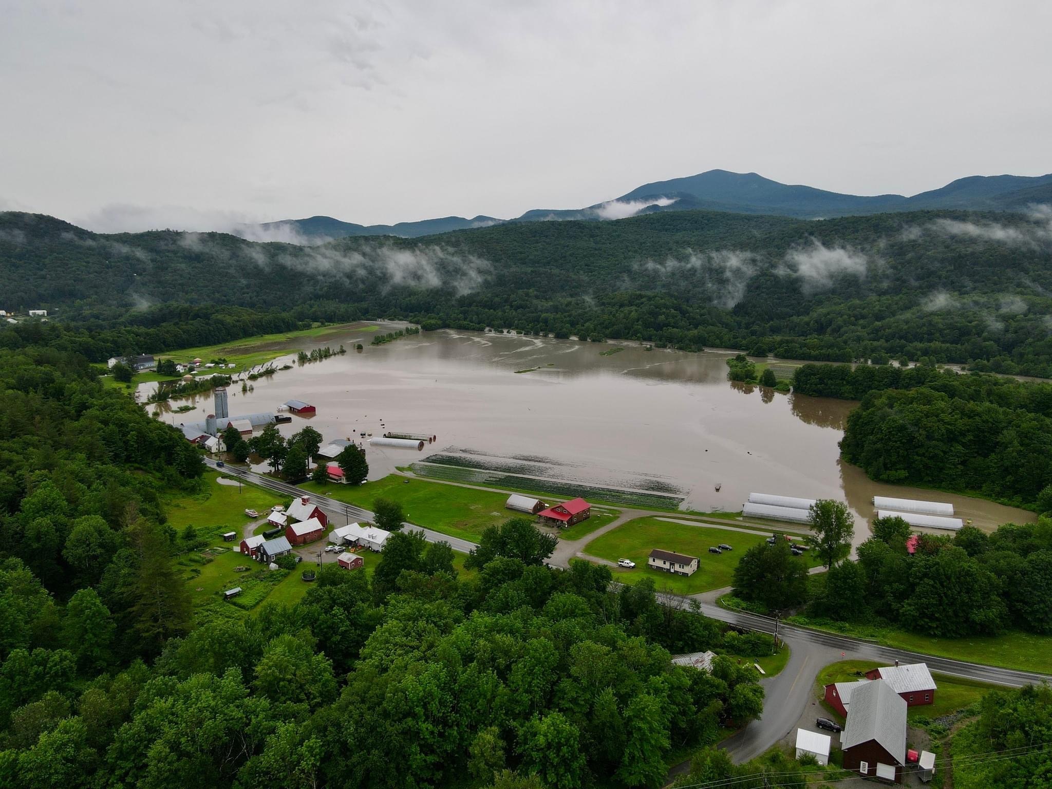 An aerial image of catastrophic flooding at Foote Brook Farm in Johnson, VT