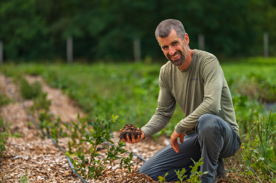 Patrick smiles in field