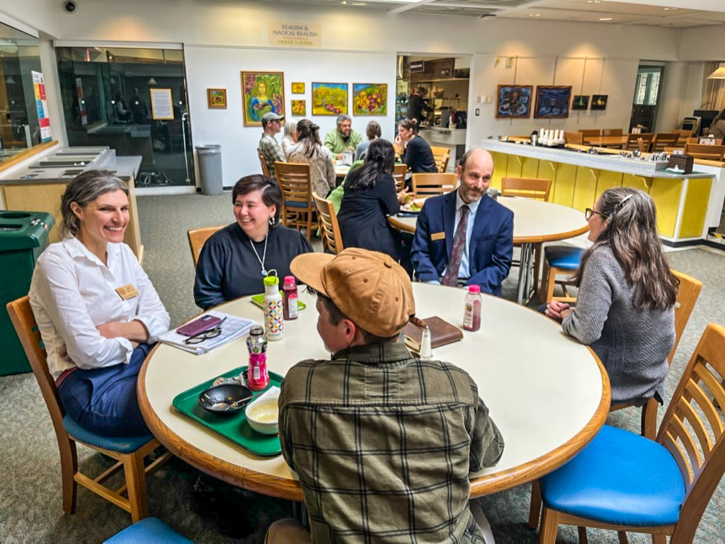 NOFA-VT Board Members, along with NOFA-VT Grassroots Organizer Jess Hays Lucas are pictured sitting around a table in the State House cafeteria as part of a recent Board Advocacy Day