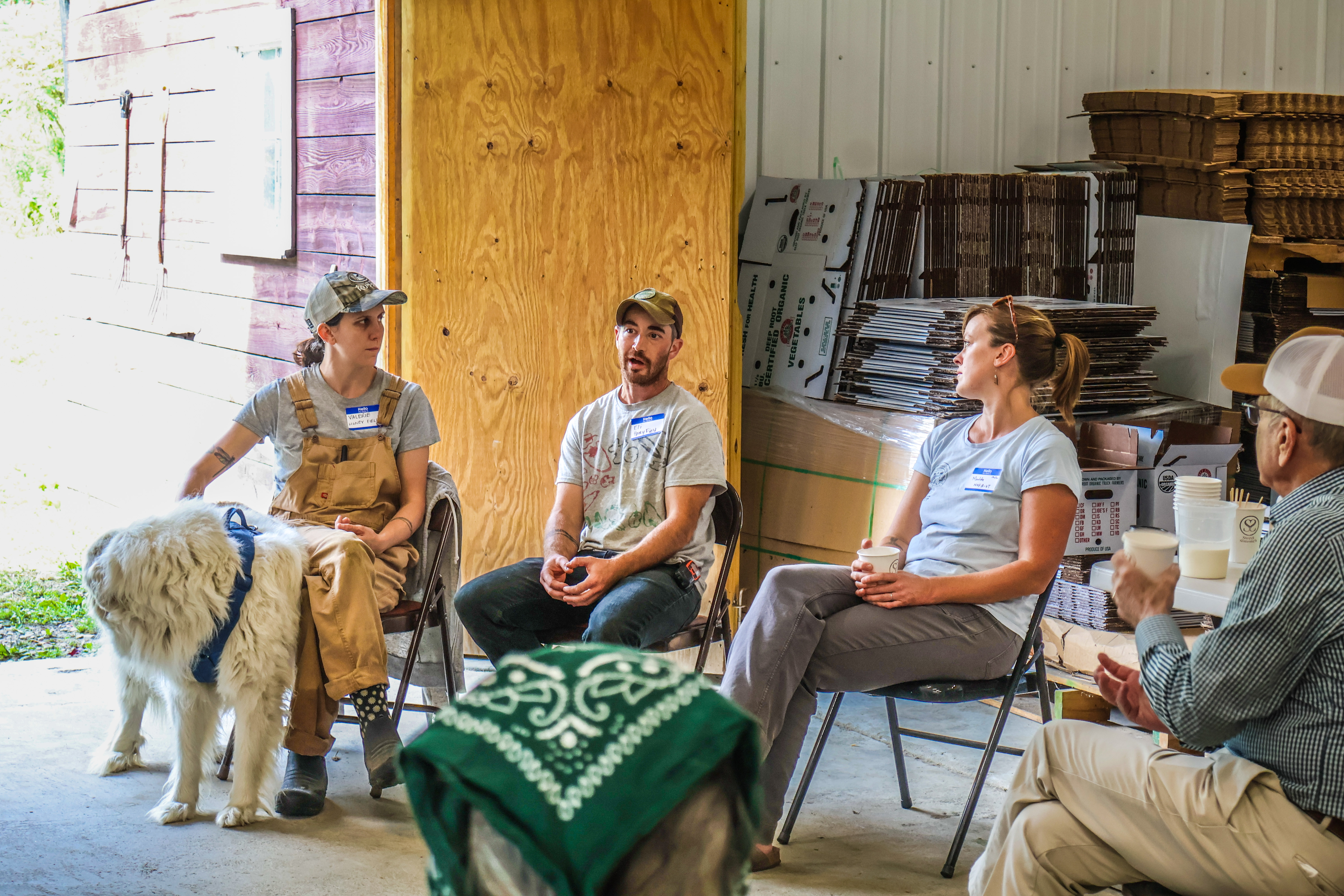 Valerie Woodhouse and Eli Hersh of Honey Field Farm are seen chatting with NOFA-VT Policy & Organizing Director Maddie Kempner and Senator Welch during a farmer round table discussion at Honey Field Farm. 