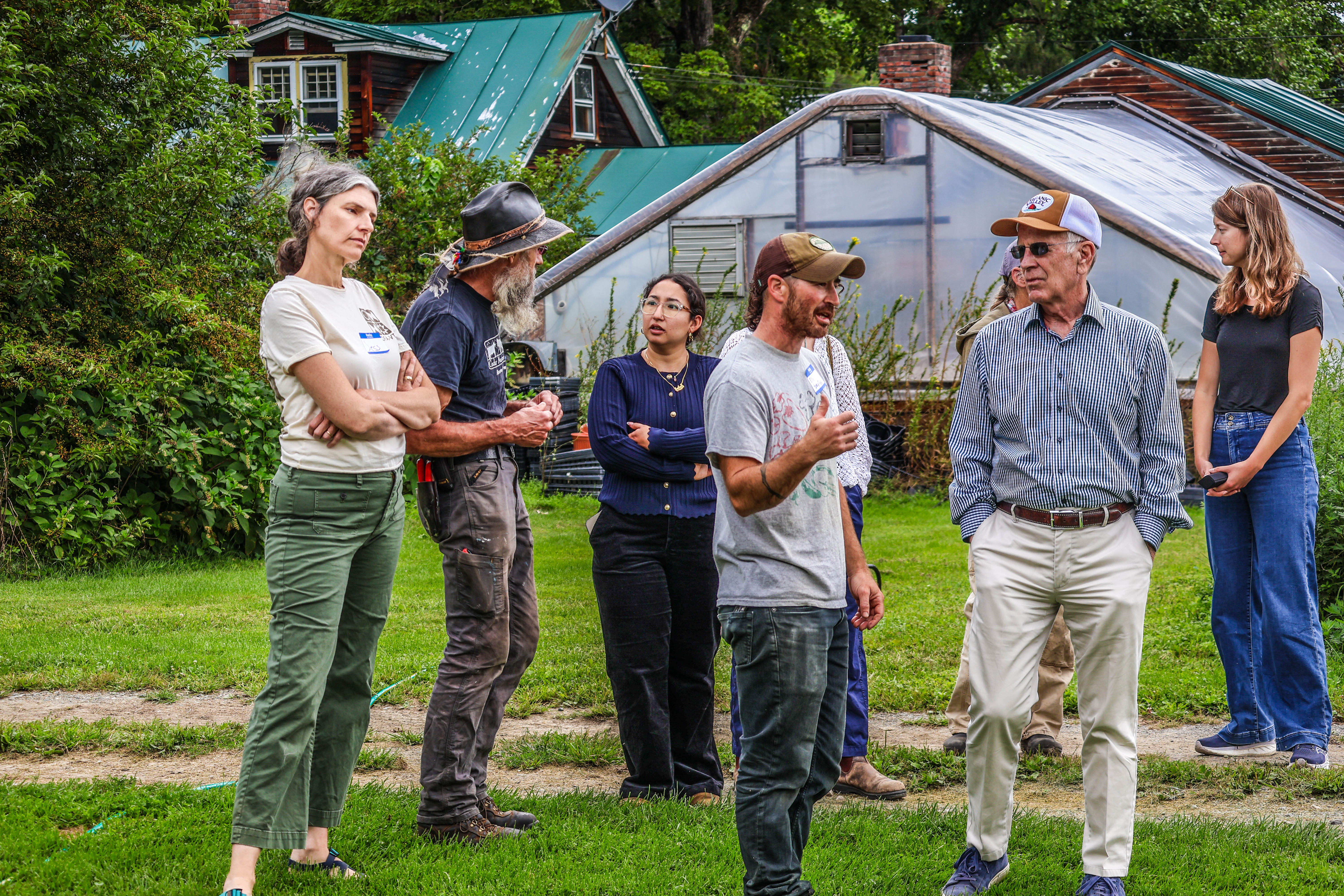 Eli Hersh of Honey Field Farm and Stephen Leslie of Cedar Mountain Farm are seen chatting with Senator Welch and his staff while NOFA-VT Grassroots Organizer Jess Hays Lucas listens.