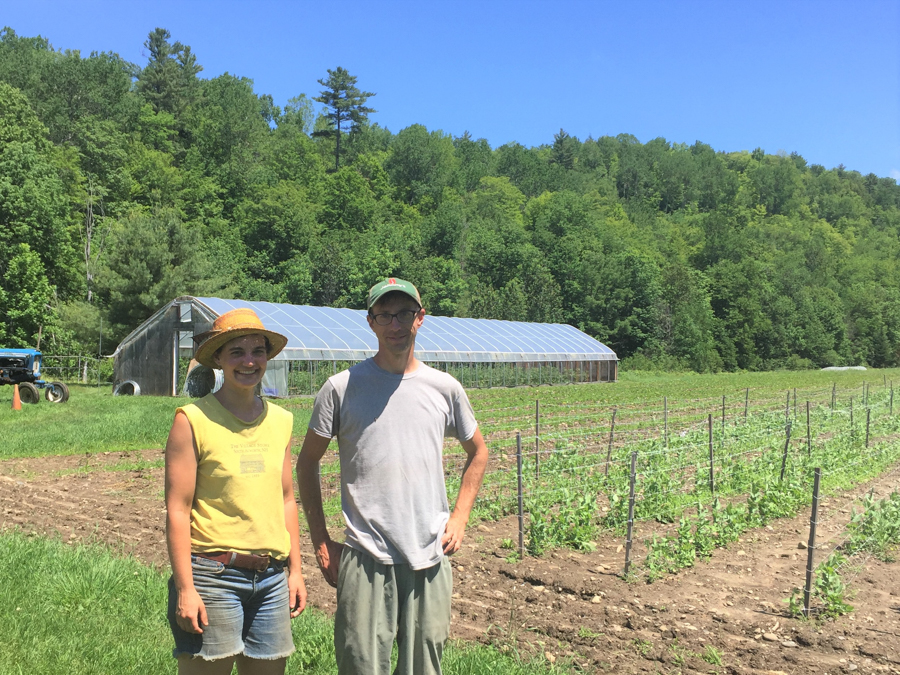 Two people smile in field