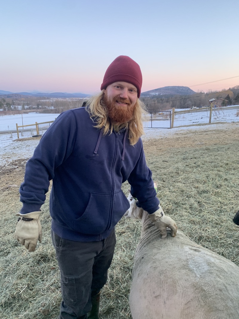 Ian stands in the pasture