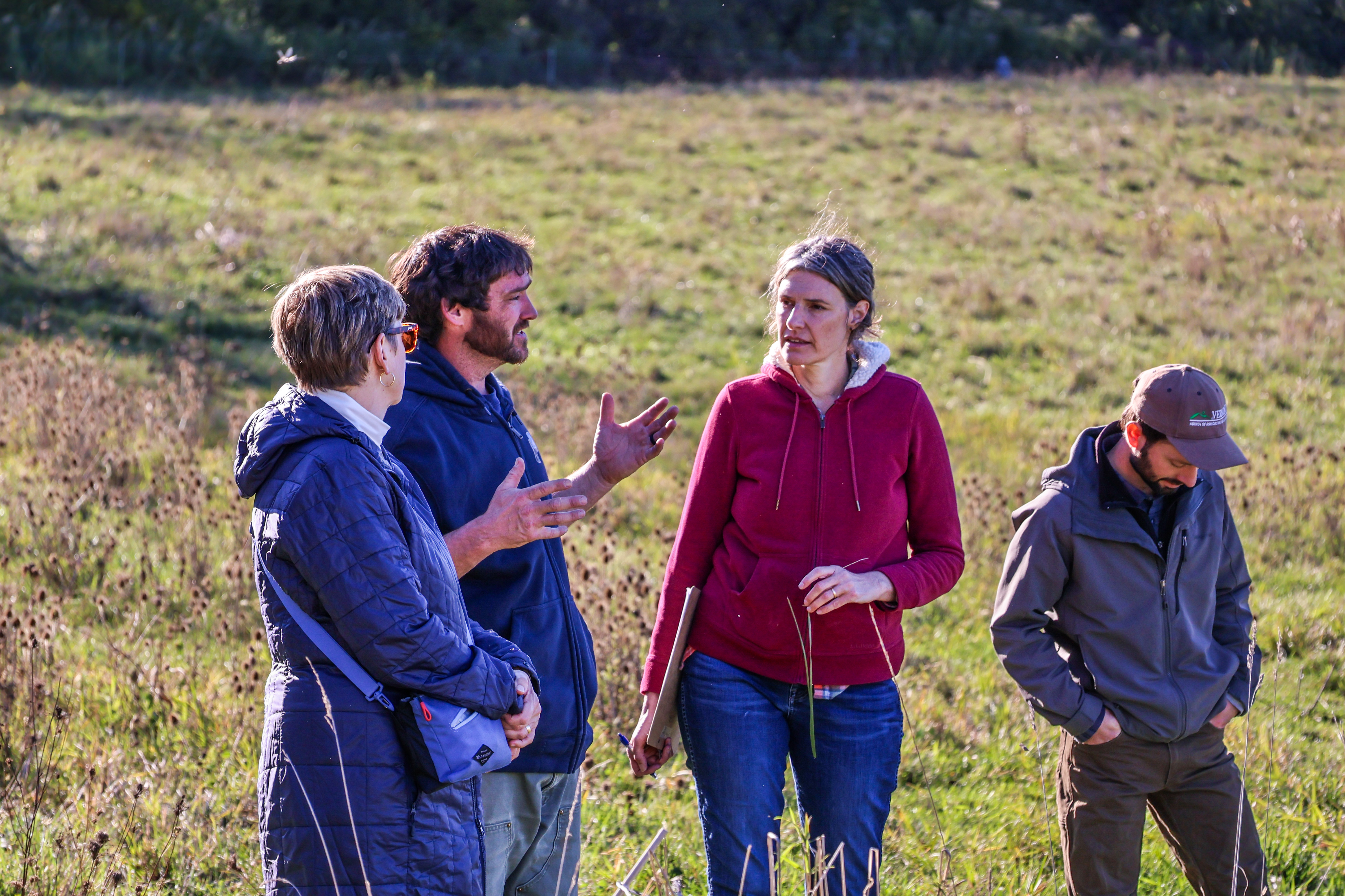 Farmer Jesse Wilbur of Lazy Dog Farm in Orwell, a Stonyfield Organic dairy, chats with state representative Robin Scheu and NOFA-VT Grassroots Organizer Jess Hays Lucas about the challenges his farm is facing in the wake of this summer's intense drought.