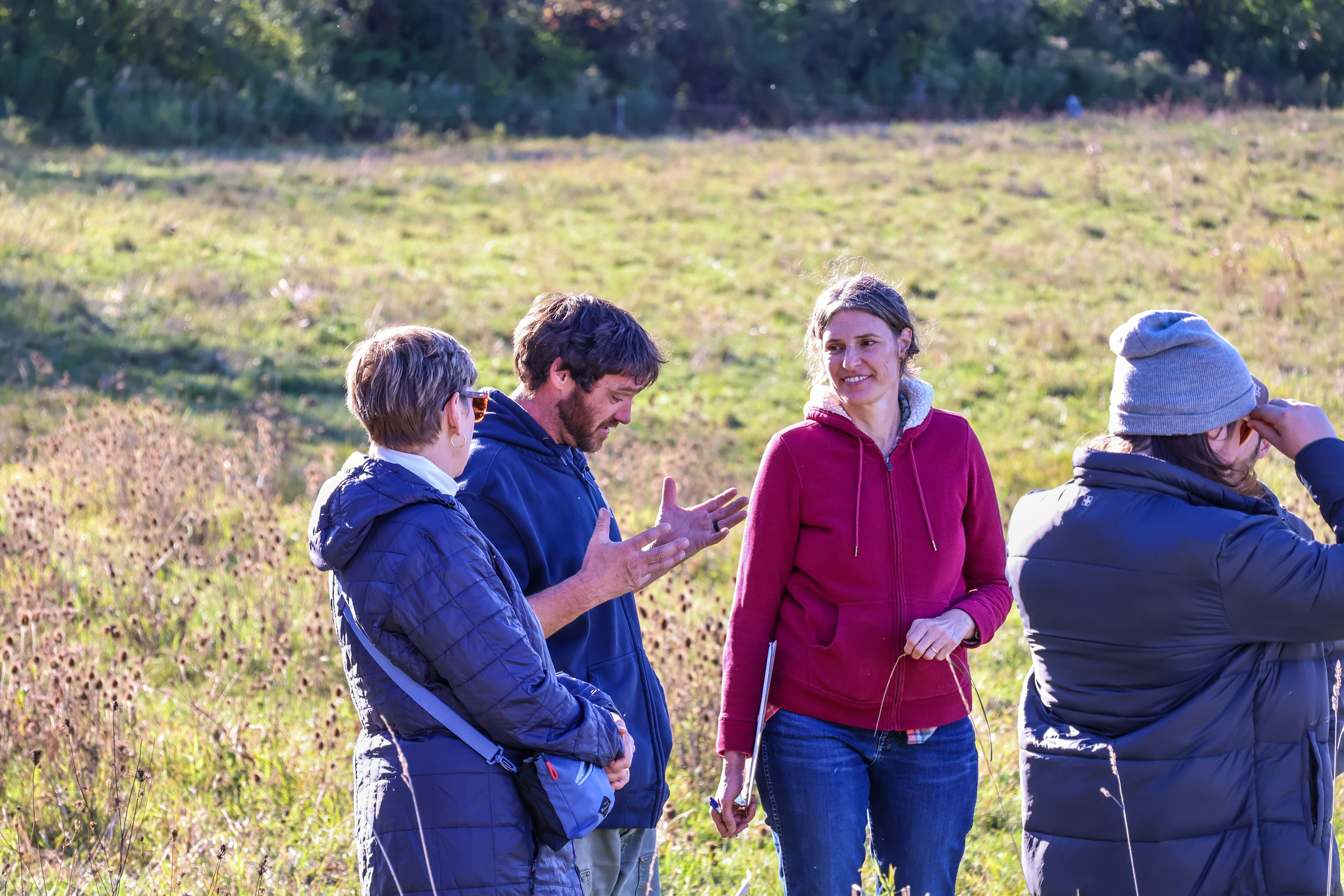 Jesse Wilbur chats with Vermont State Representative Robin Scheu and NOFA-VT Grassroots Organizer Jessica Hays Lucas during his farm tour