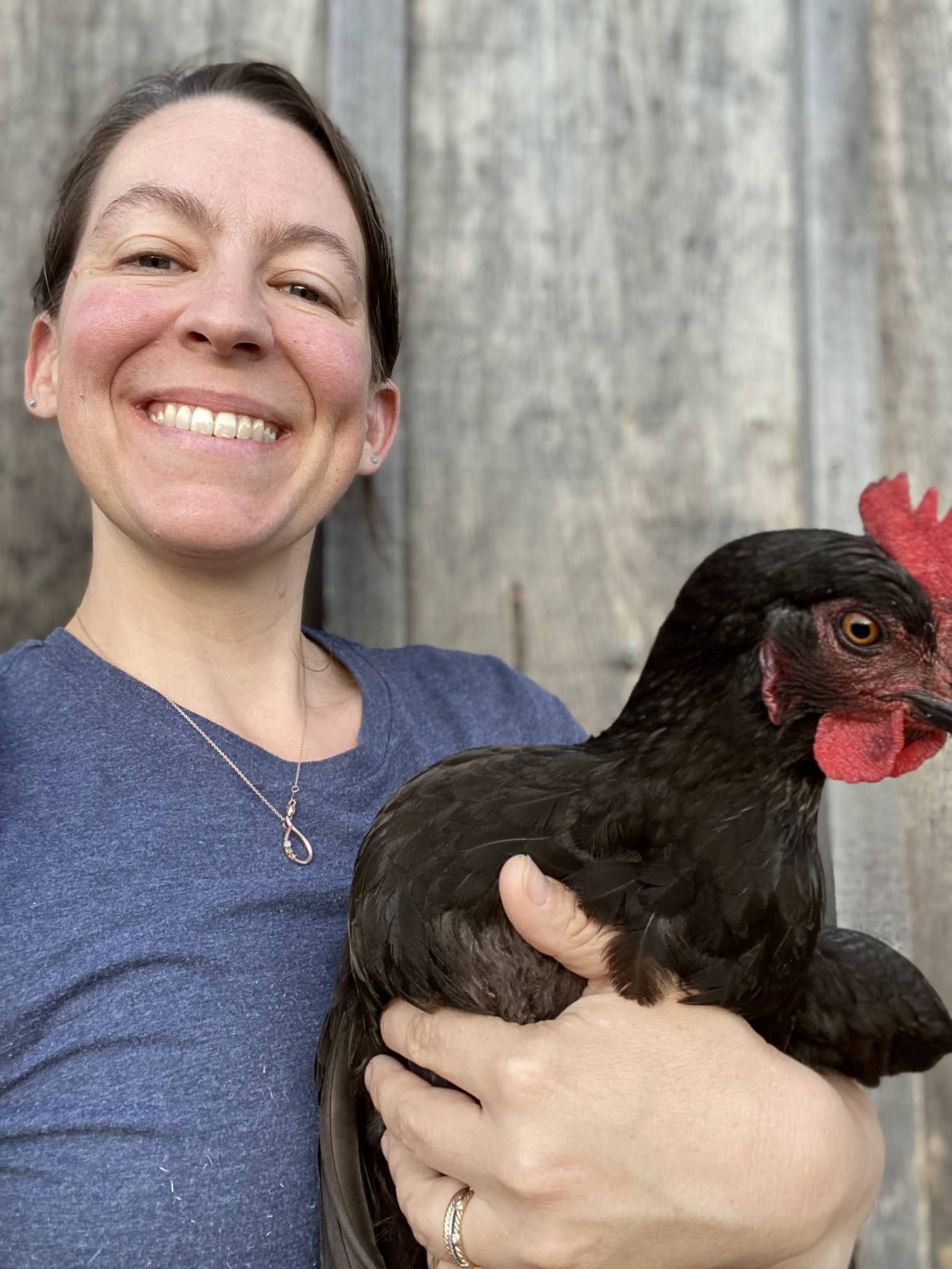 Lisa holds a chicken