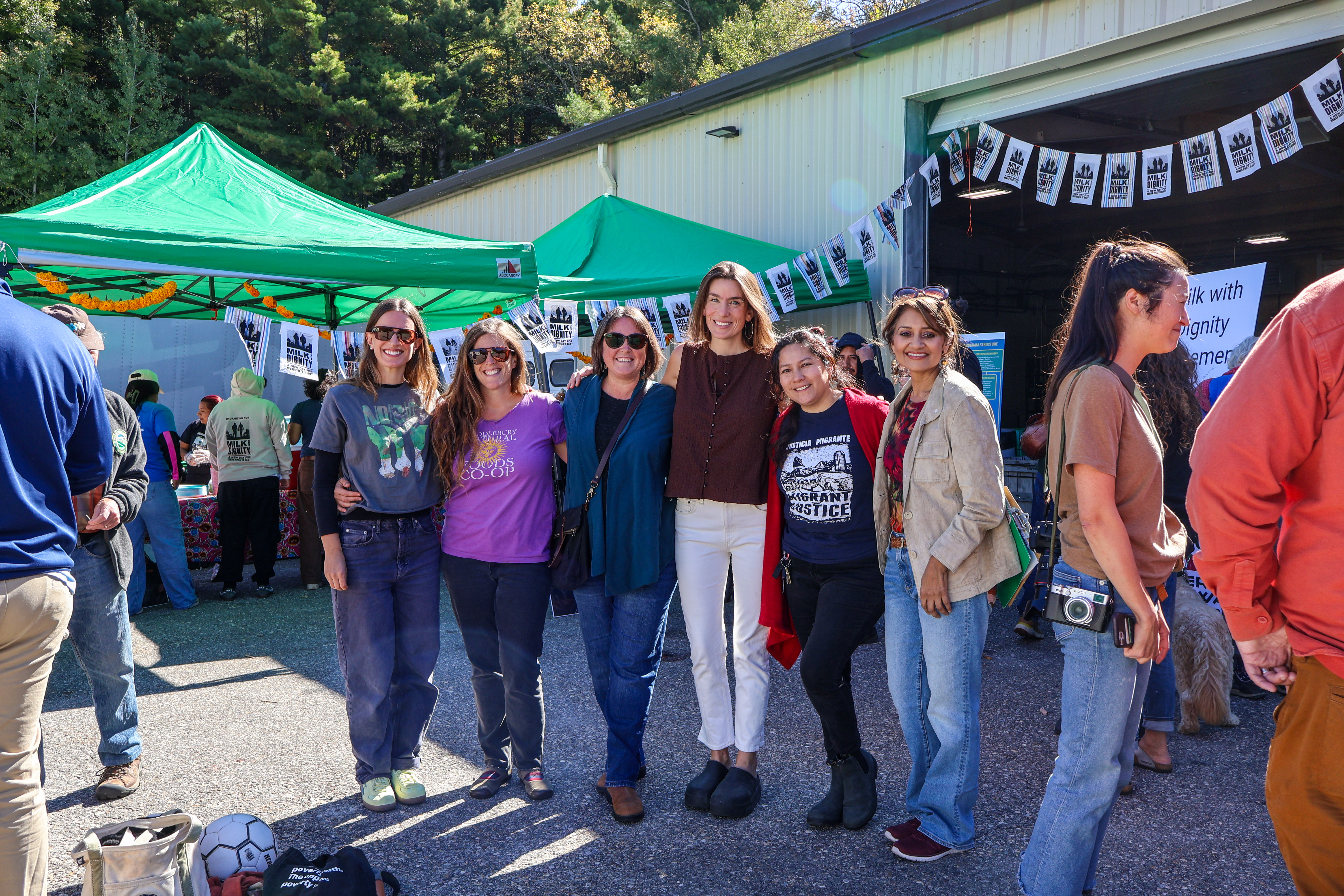 Cheryl Pinto, Global Head of Values Led Sourcing at Ben & Jerry’s stands on the far right alongside Mariel from Migrant Justice, NOFA-VT Executive Director Grace Oedel, Helen Rortvedt, NOFA-VT Deputy Director of Programs and Operations, Erin Buckwalter, NOFA-VT Deputy Director of Engagement and Development, and Lindsey Brand, NOFA-VT Director of Marketing & Communications