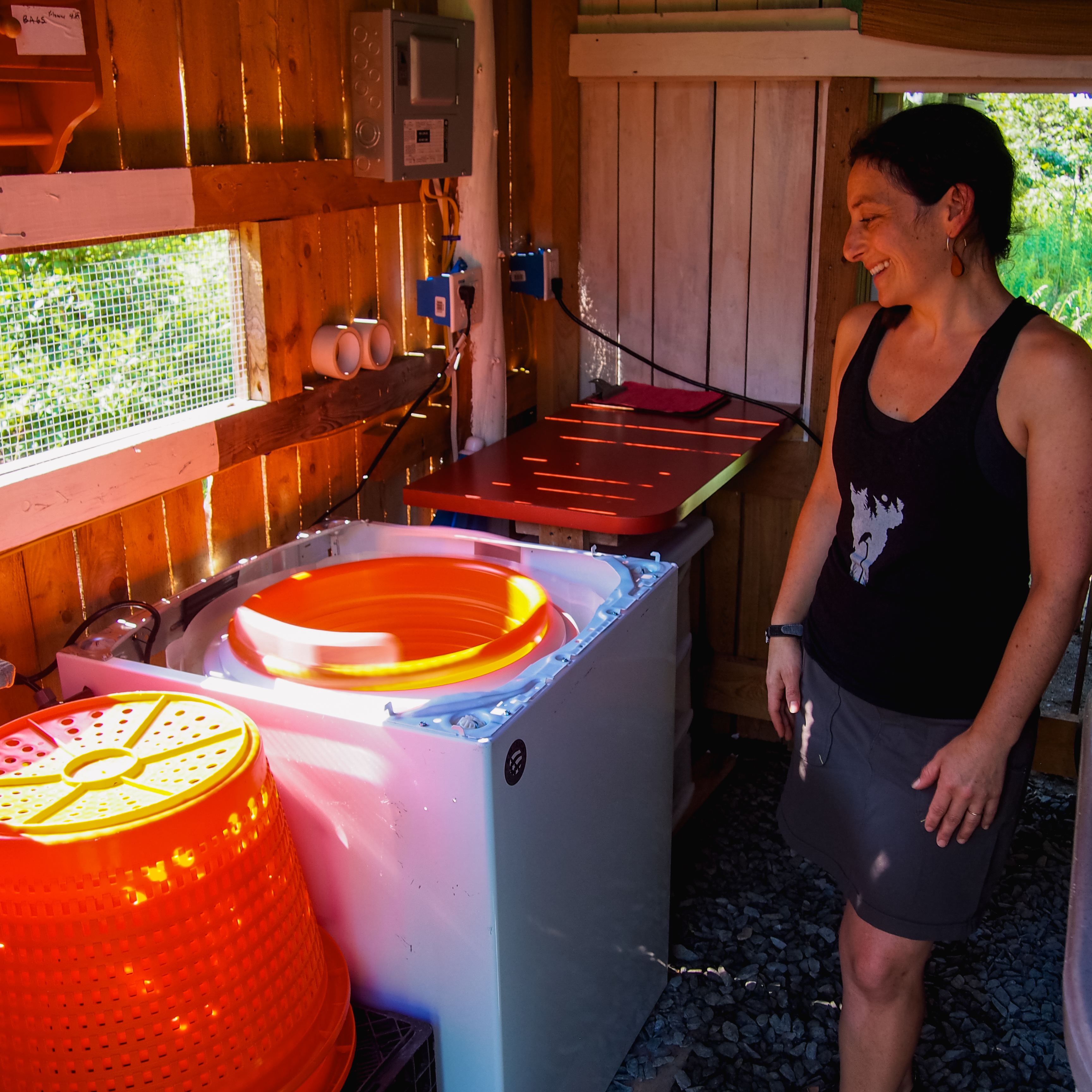 Liz Echevarria demonstrates how her new energy efficient greens spinner works.