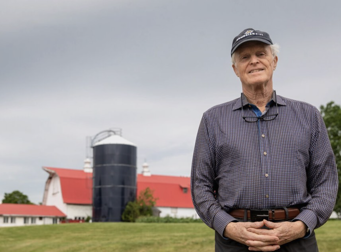 Will Raap stands outside on a dairy farm