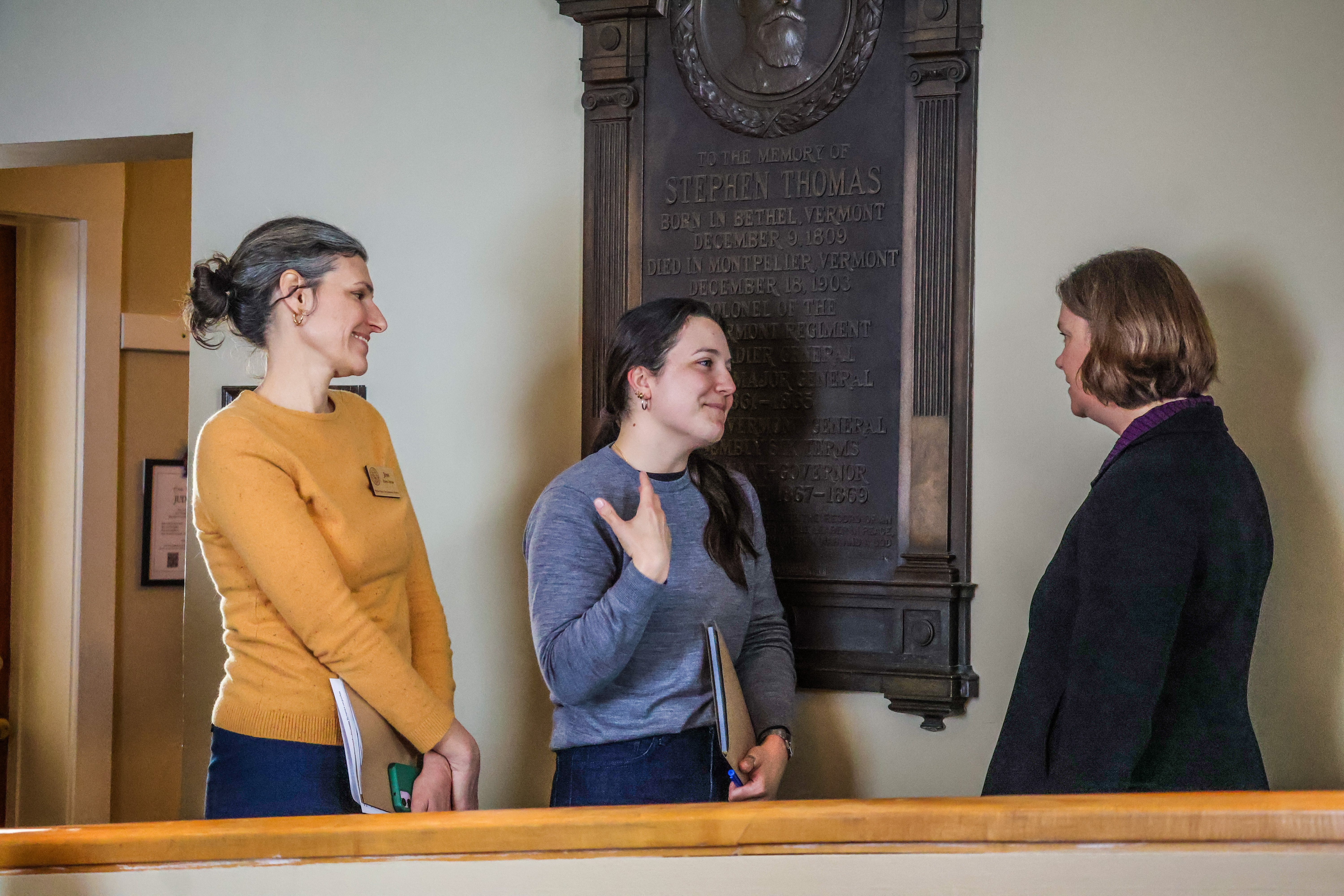 NOFA-VT Member Christina Bertorelli chats with Senator Ruth Hardy as NOFA-VT Grassroots Organizer Jess Hays Lucas stands by in support