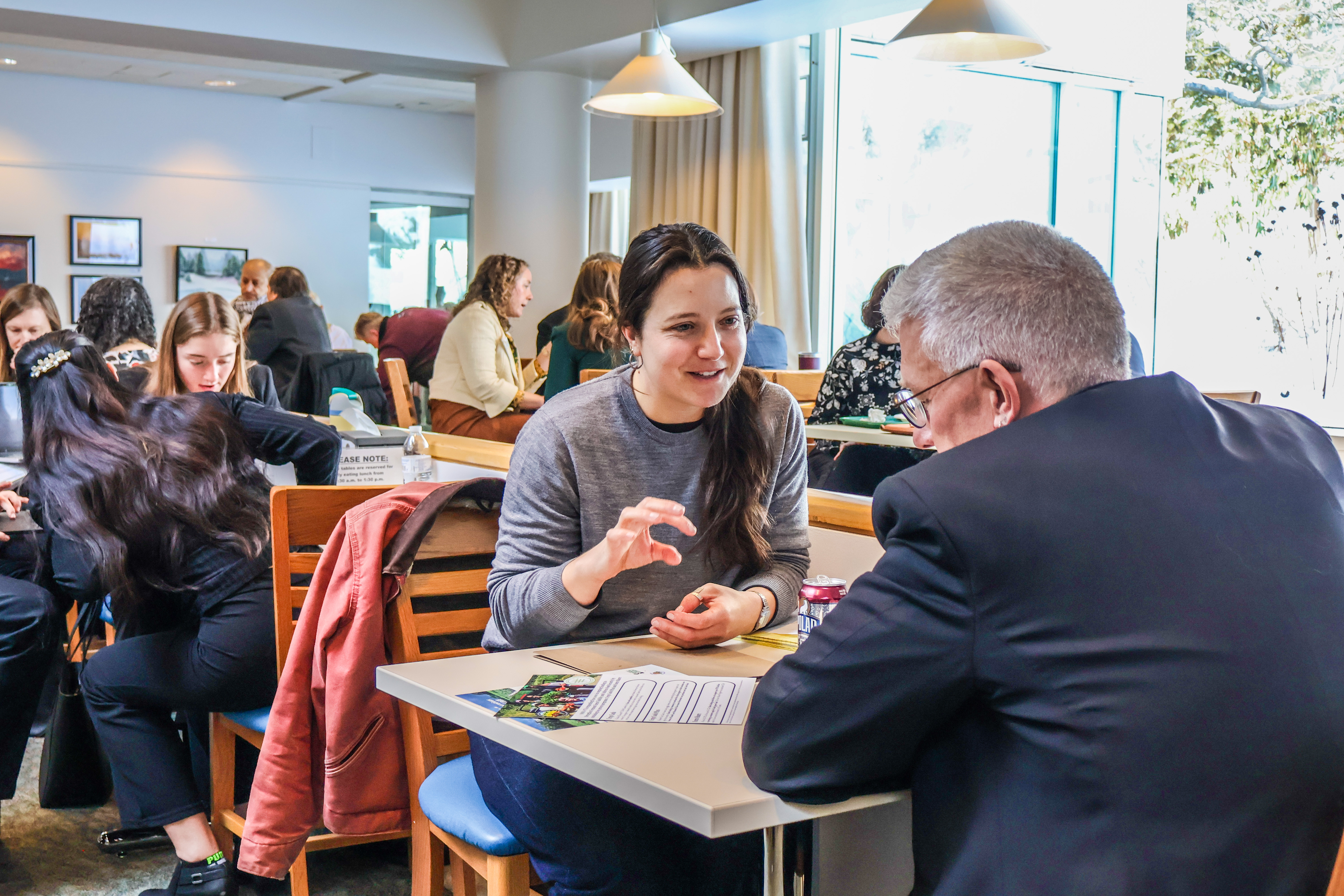 NOFA-VT member Christina Bertorelli engages in conversation with a Vermont legislator to advocate in support of NOFA-VT's Farm Security Fund at a recent NOFA-VT State House Day