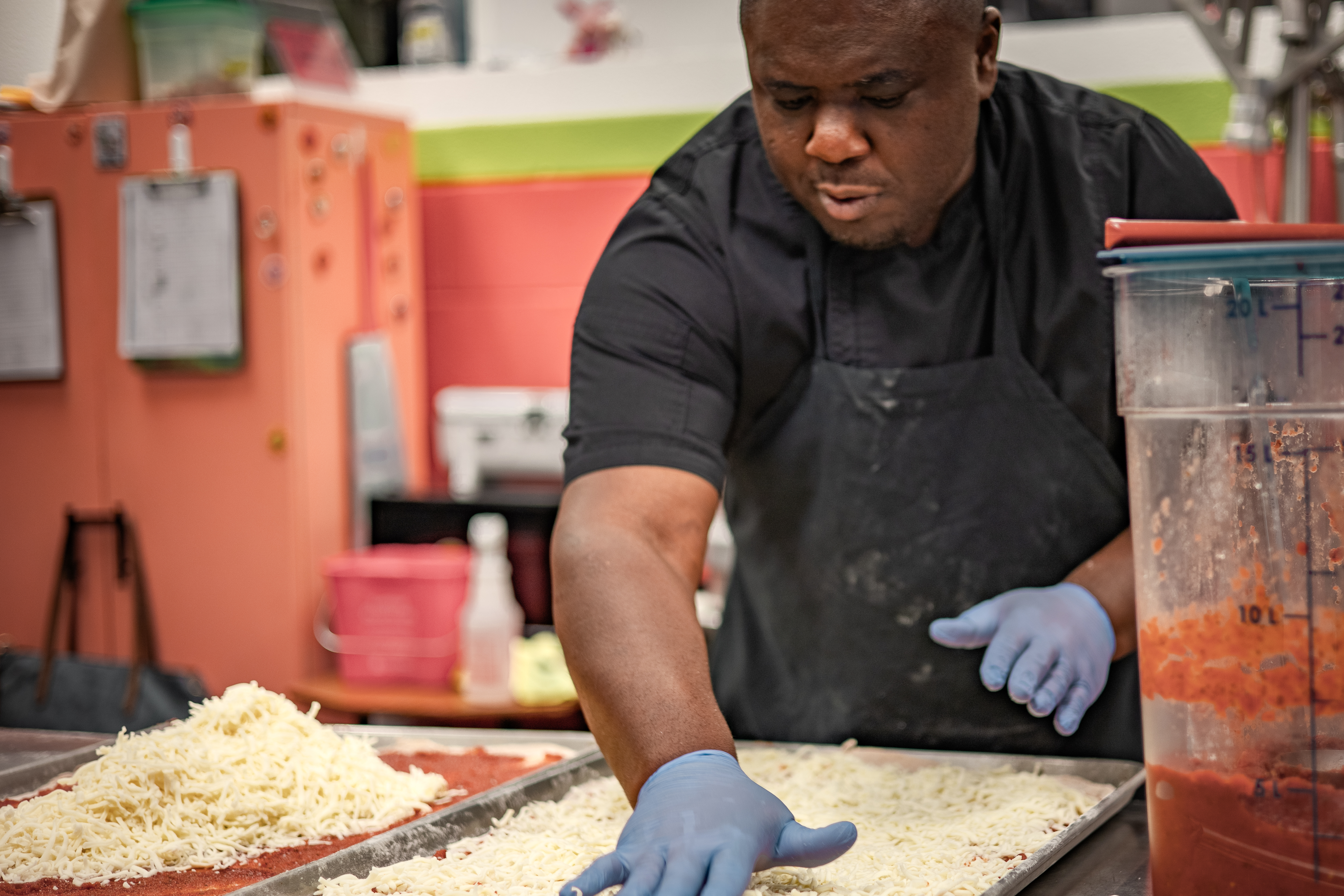 Vermont school nutrition professional Thristan Coke makes pizzas from scratch using local, organic grains in a Vermont school cafeteria