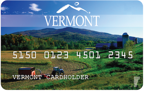 Image of the Vermont EBT card. The card says "Vermont" at the top, followed by a long string of numbers in the middle (similar to a credit card), and the words "Vermont Cardholder" at the bottom. The background of the card is a farm with hills in the distance.