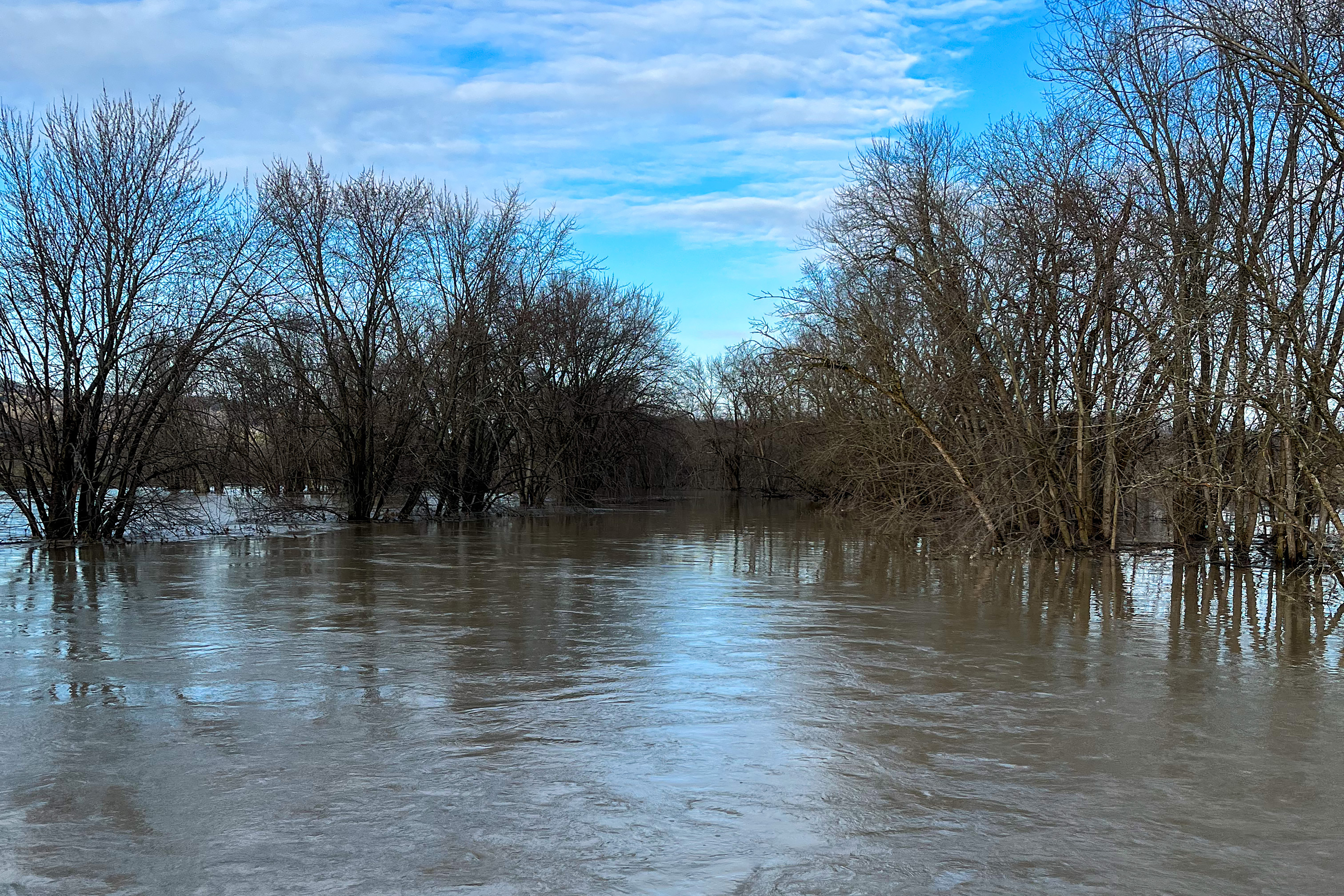 The Lemon Fair River in Weybridge, VT, overflows its banks and floods the adjacent farm fields