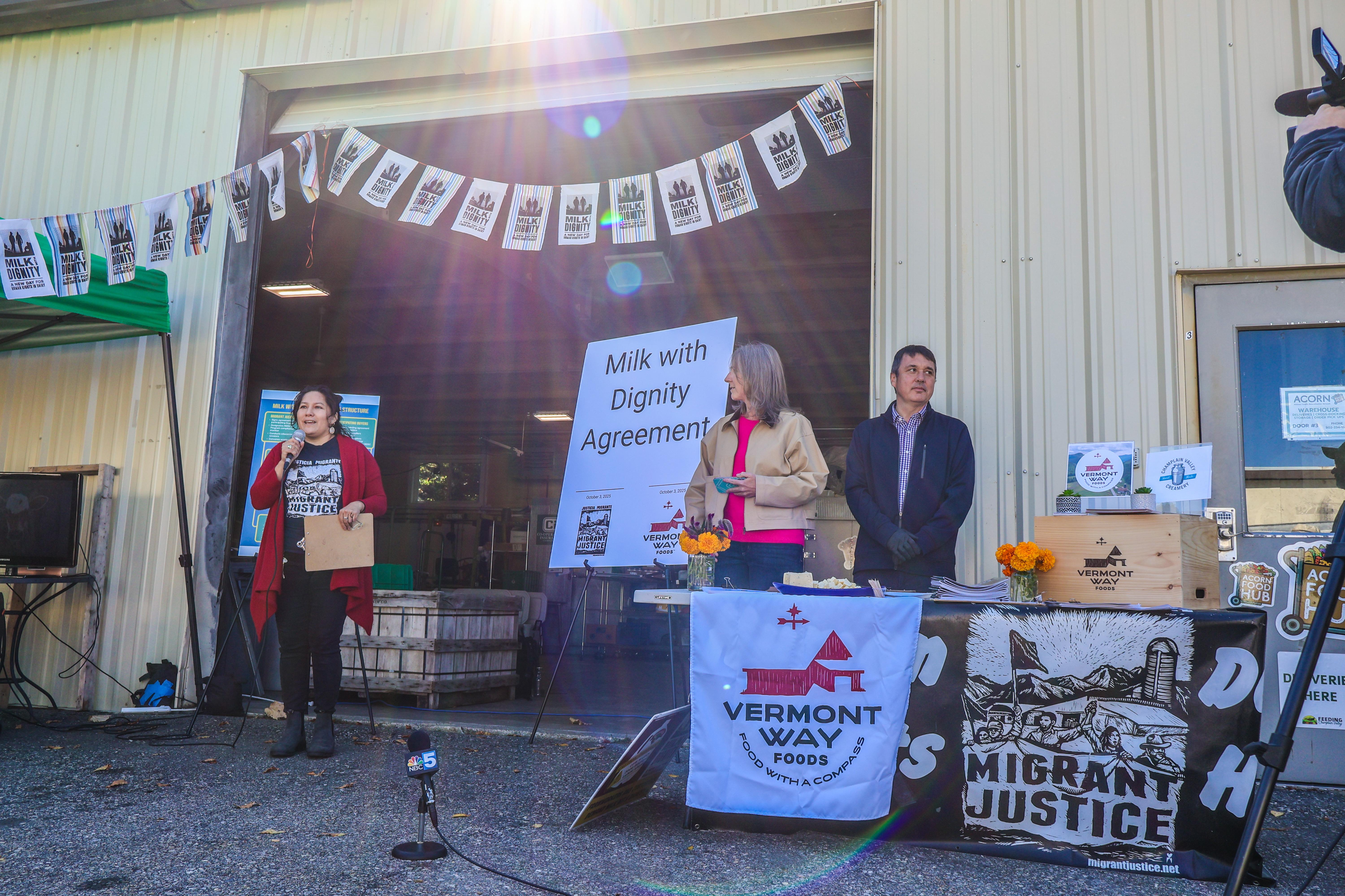 Leaders from Migrant Justice and Vermont Way Foods present at a press conference at Middlebury's ACORN food hub