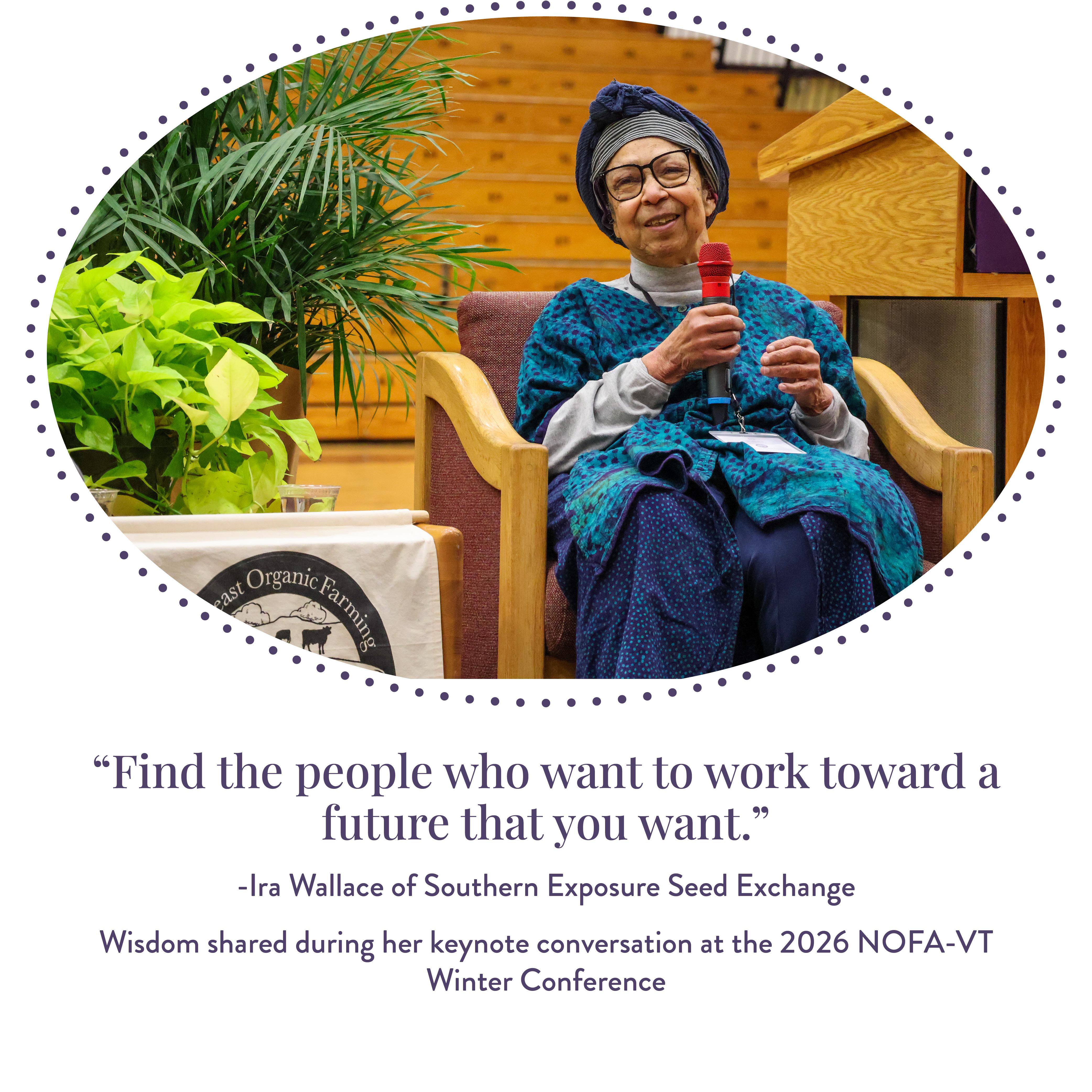 Ira Wallace is shown seated in a chair holding a microphone and delivering the 2026 NOFA-VT Winter Conference keynote address next to a few potted plants and a NOFA-VT banner