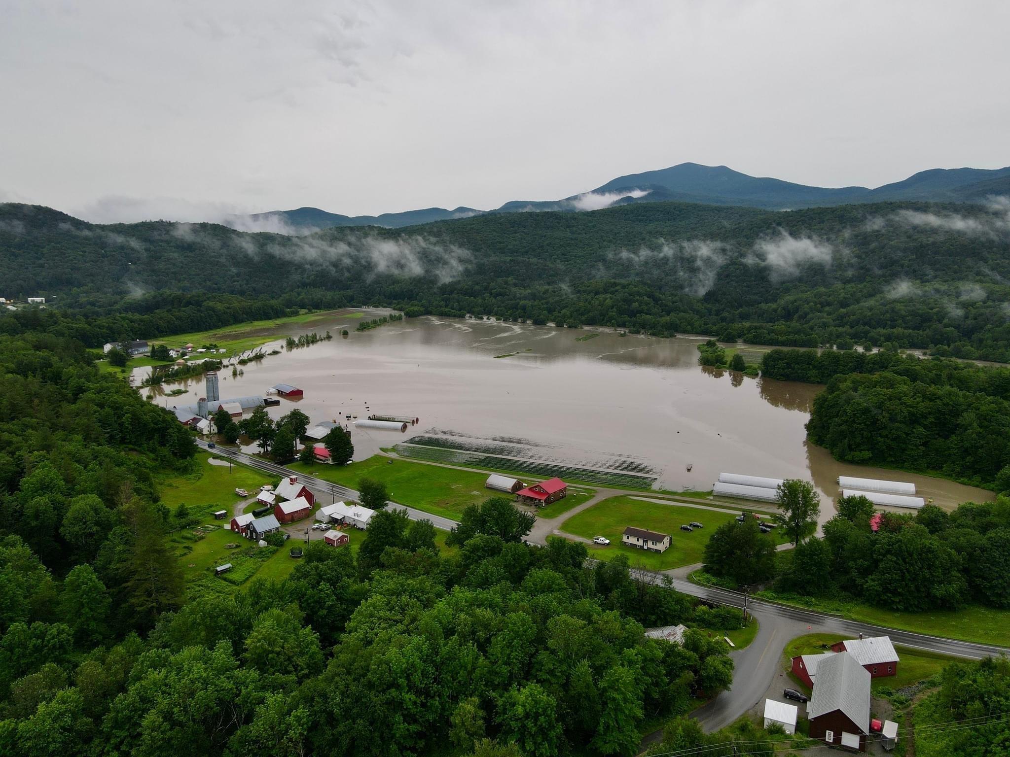 Aerial shot of Foote Brook Farm in Johnson after extreme flooding in 2023, leaving the majority of their farm fields and several buildings under water.