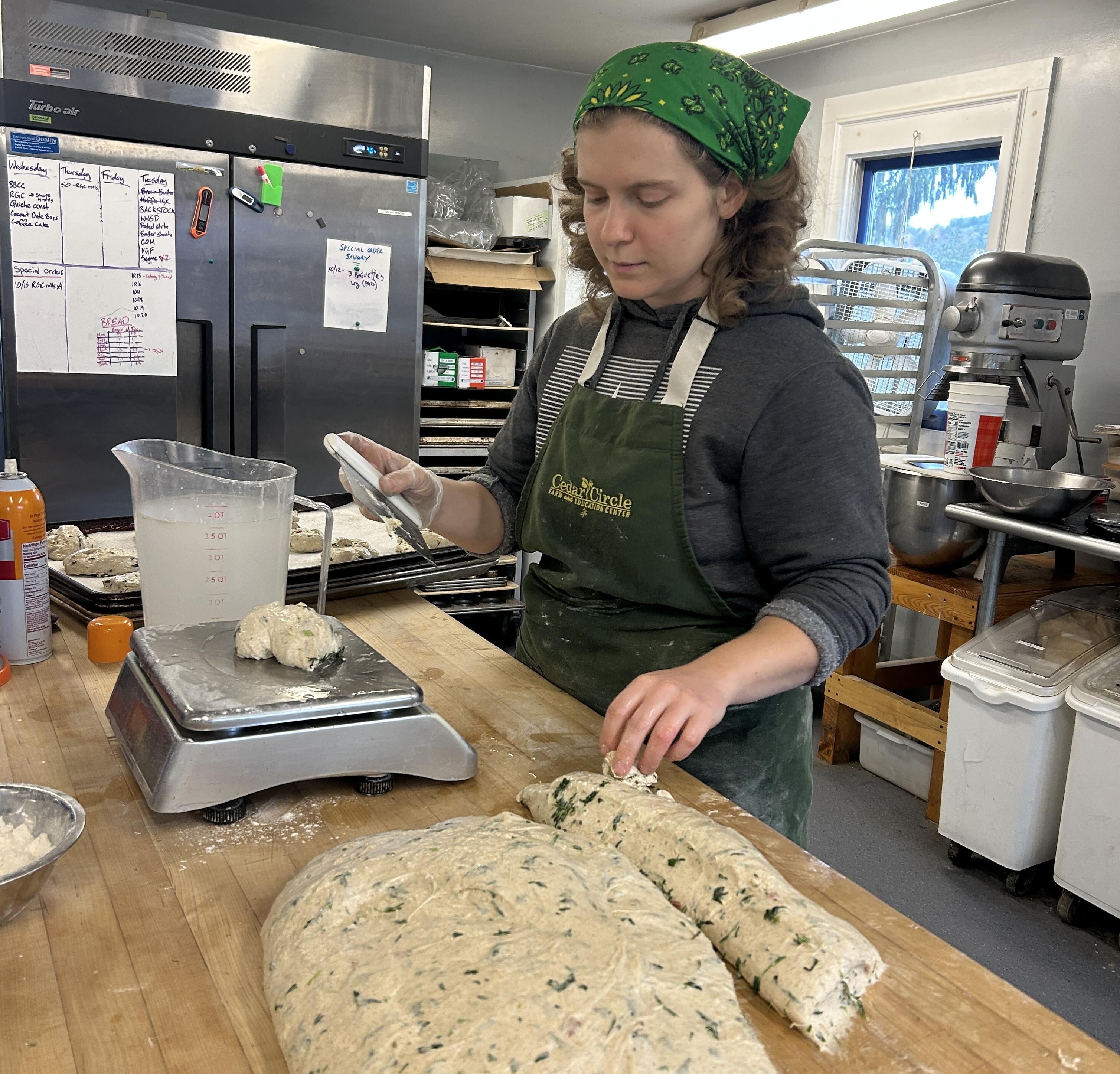 Baker making focaccia dough