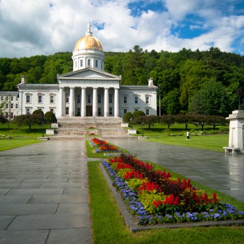 Vermont statehouse with a garden in front of it