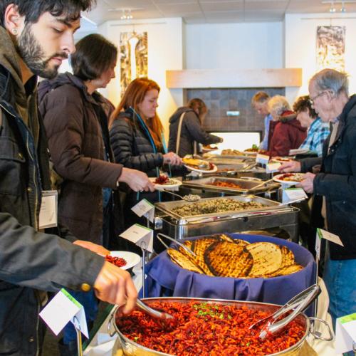 People get lunch at a buffet