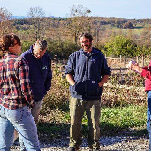 Jesse Wilber of Lazy Dog Farm chatting with Vermont Senator Steve Heffernan and the NOFA-VT Policy and Advocacy team about the impacts of the severe drought on his organic dairy farm in Orwell