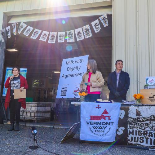 Leaders from Migrant Justice and Vermont Way Foods present at a press conference at Middlebury's ACORN food hub