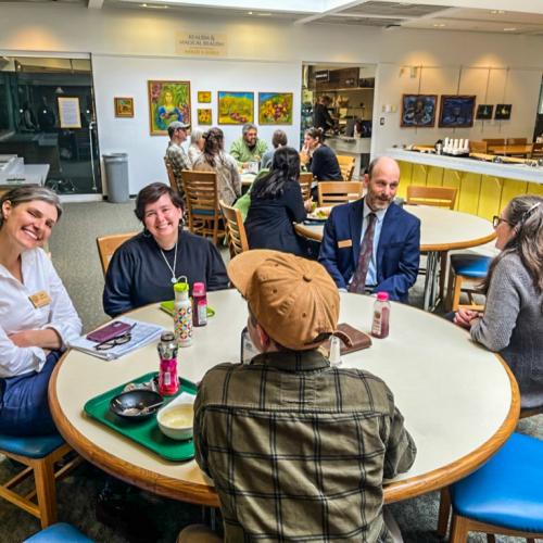 NOFA-VT Board Members, along with NOFA-VT Grassroots Organizer Jess Hays Lucas are pictured seated around a table in the State House cafeteria as part of a recent Board Advocacy Day
