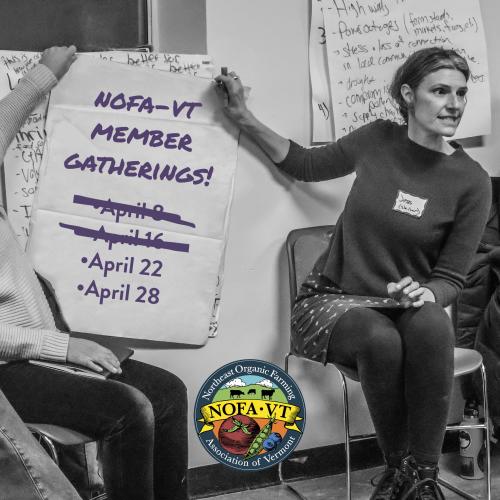 A black and white photo of NOFA-VT Grassroots Organizer Jess Hays Lucas holds up a large piece of paper from a flip chart that reads, "NOFA-VT Member Gatherings" then lists the dates of the remaining member gatherings. There's also a color NOFA-VT logo centered at the bottom of the image