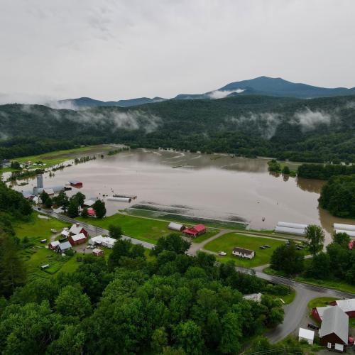 Aerial shot of Foote Brook Farm in Johnson after extreme flooding in 2023, leaving the majority of their farm fields and several buildings under water.