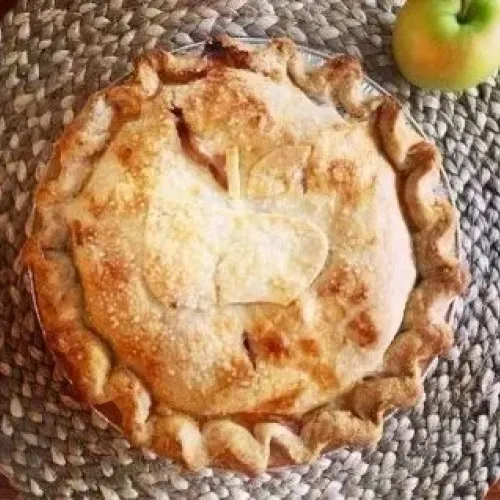 apple pie with apple symbol on crust